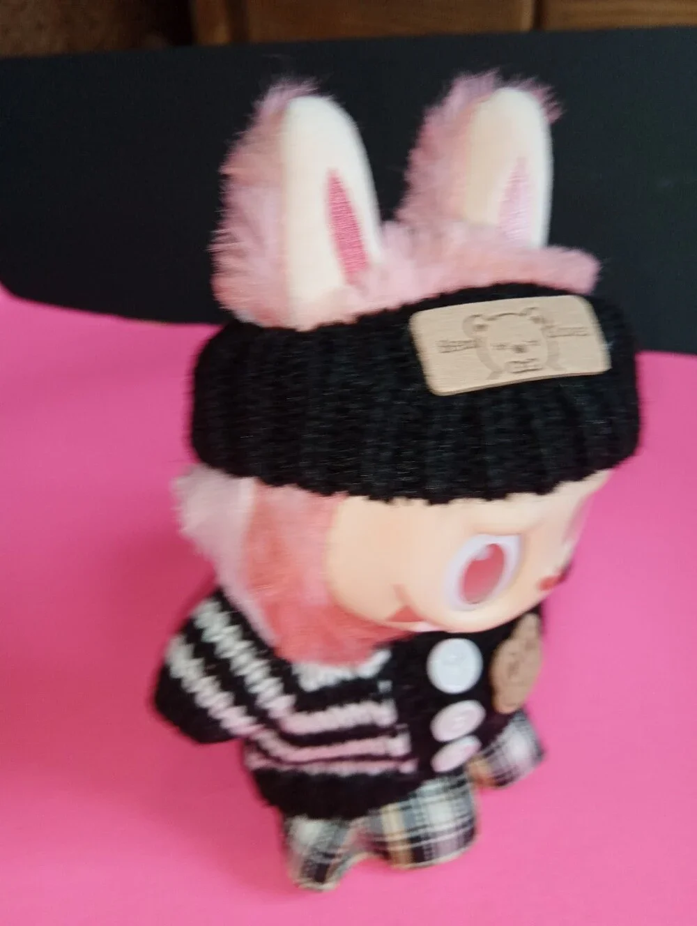 Labibu Doll outfit. Wearing A Knit Striped Sweater, Plaid Skirt, And Headband.